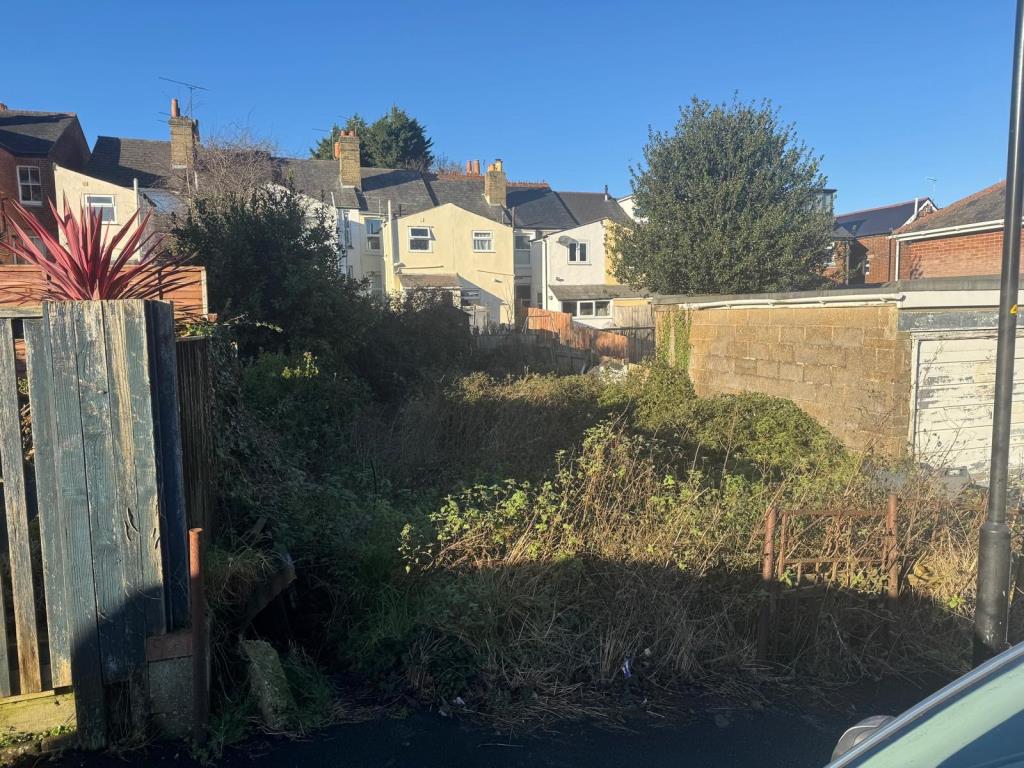 Lot: 49 - LAND WITH OUTLINE CONSENT FOR THE CONSTRUCTION OF A DWELLING - View of site from the road